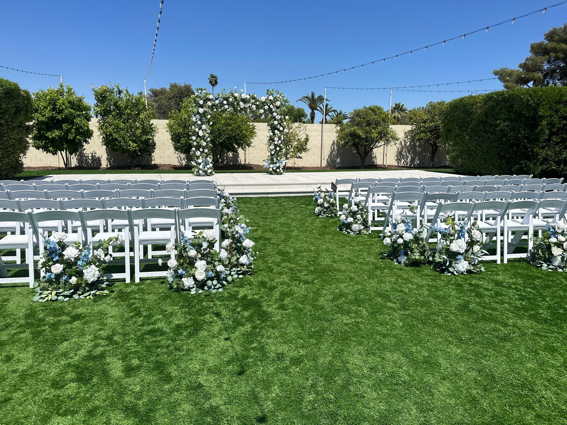 kylee-aisle-flowers-with-arch-covering