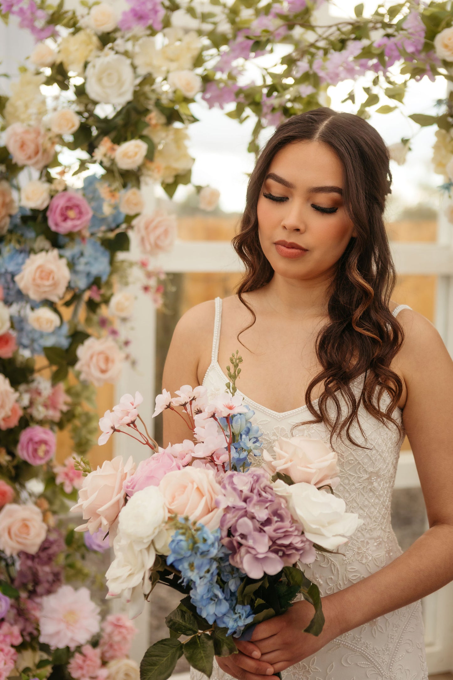 maylee-wedding-arch-bride-with-bouquet