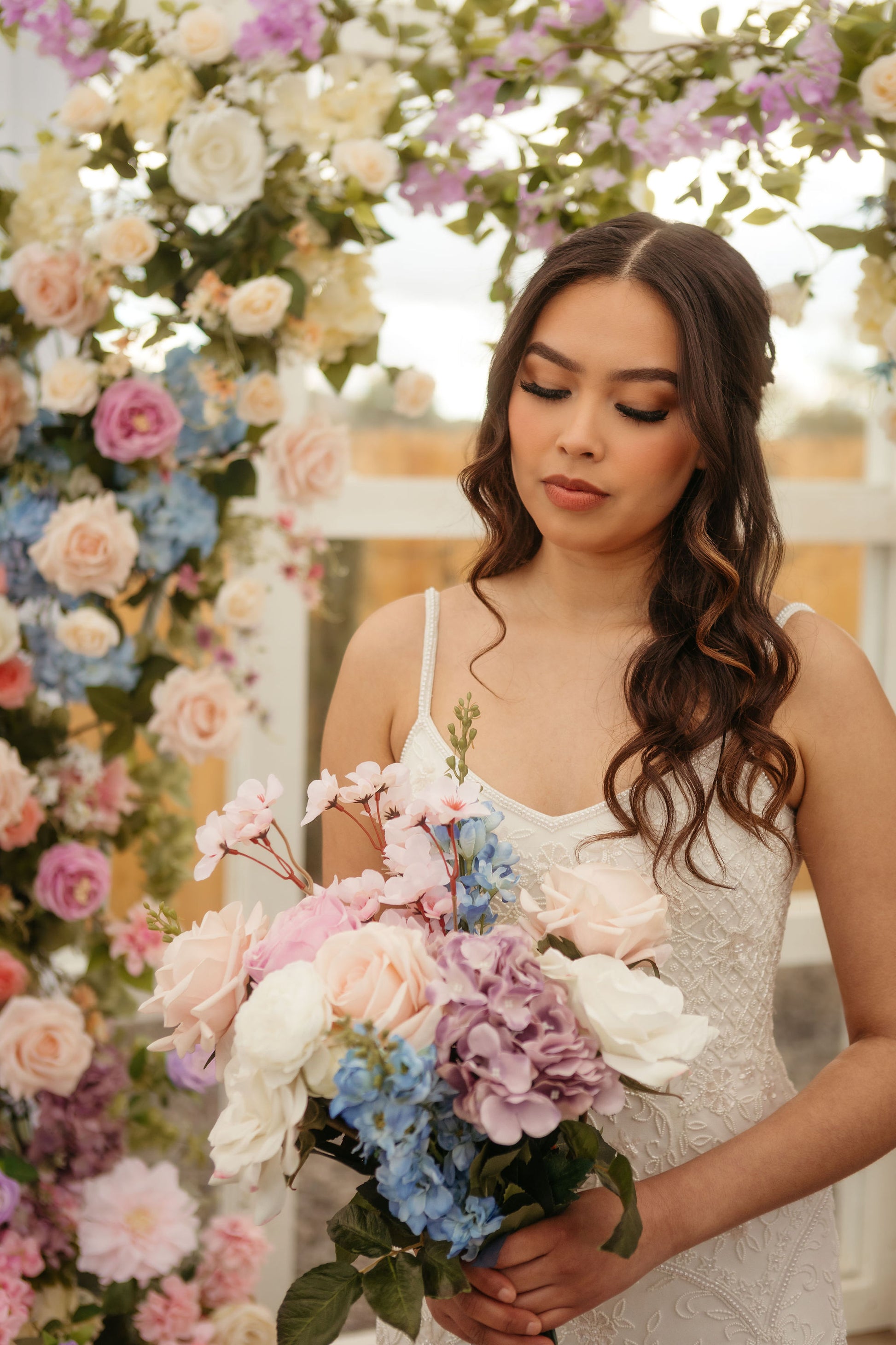 maylee-wedding-arch-bride-with-bouquet