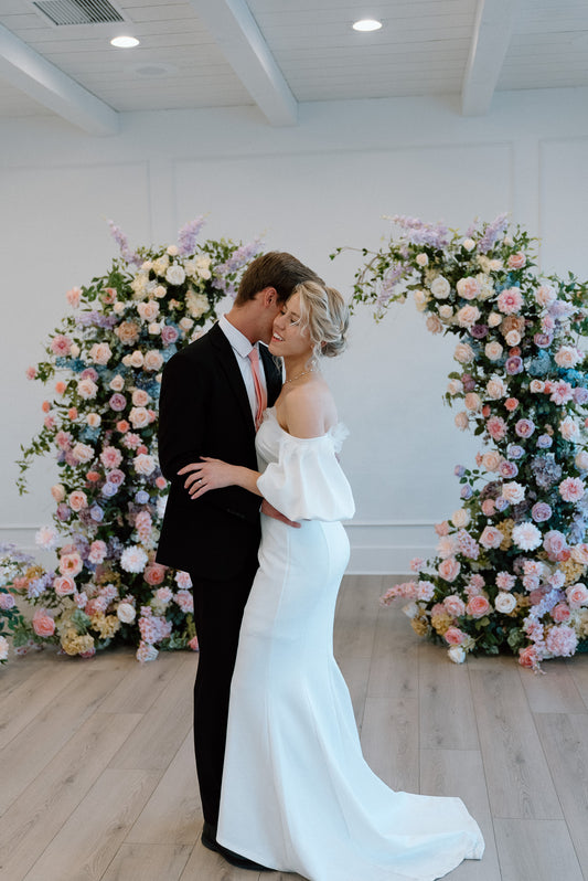 maylee-wedding-arch-with-couple
