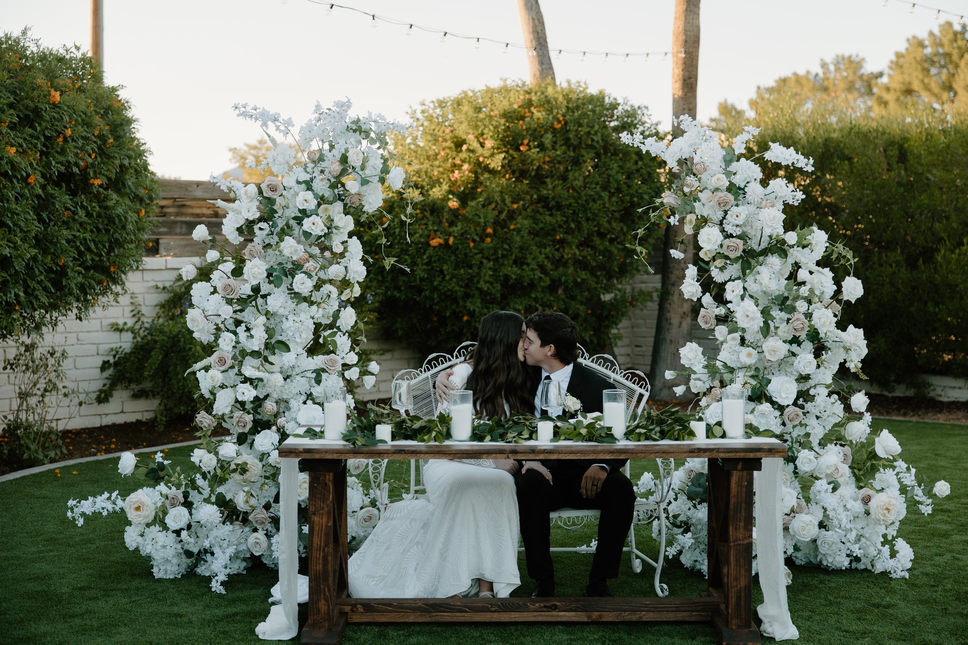emrie-wedding-arch-couple-table