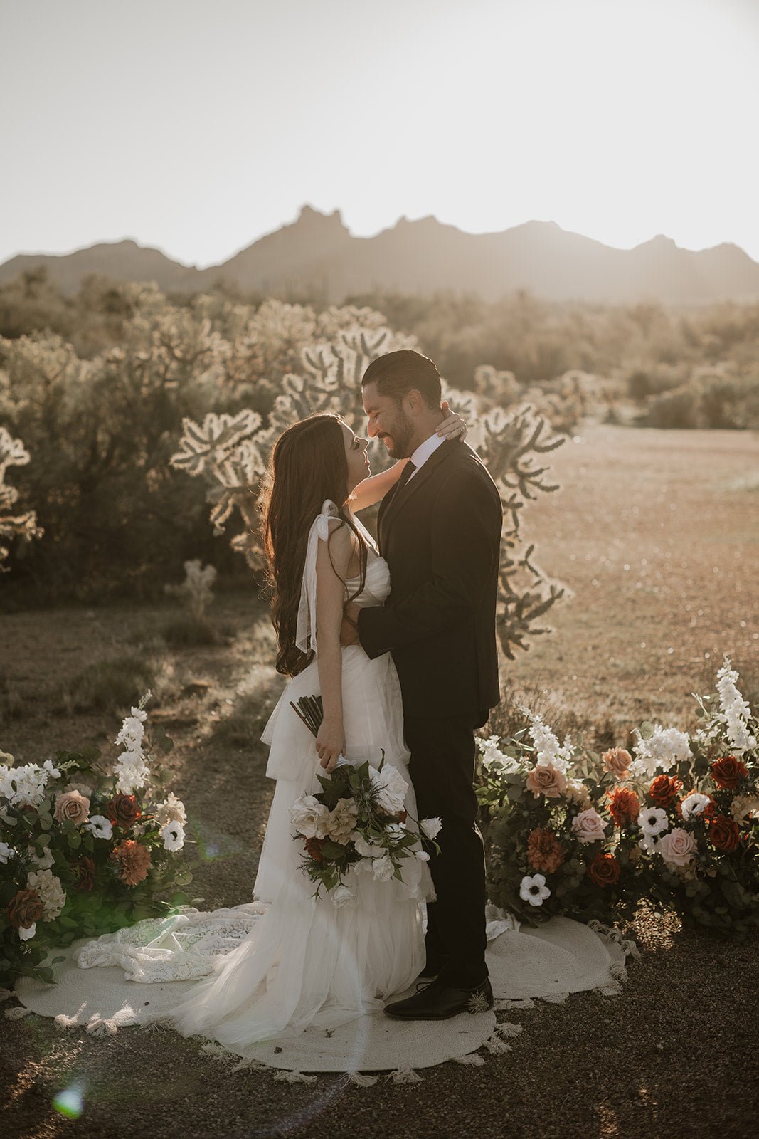 hallie-aisle-flowers-couple-at-sunset